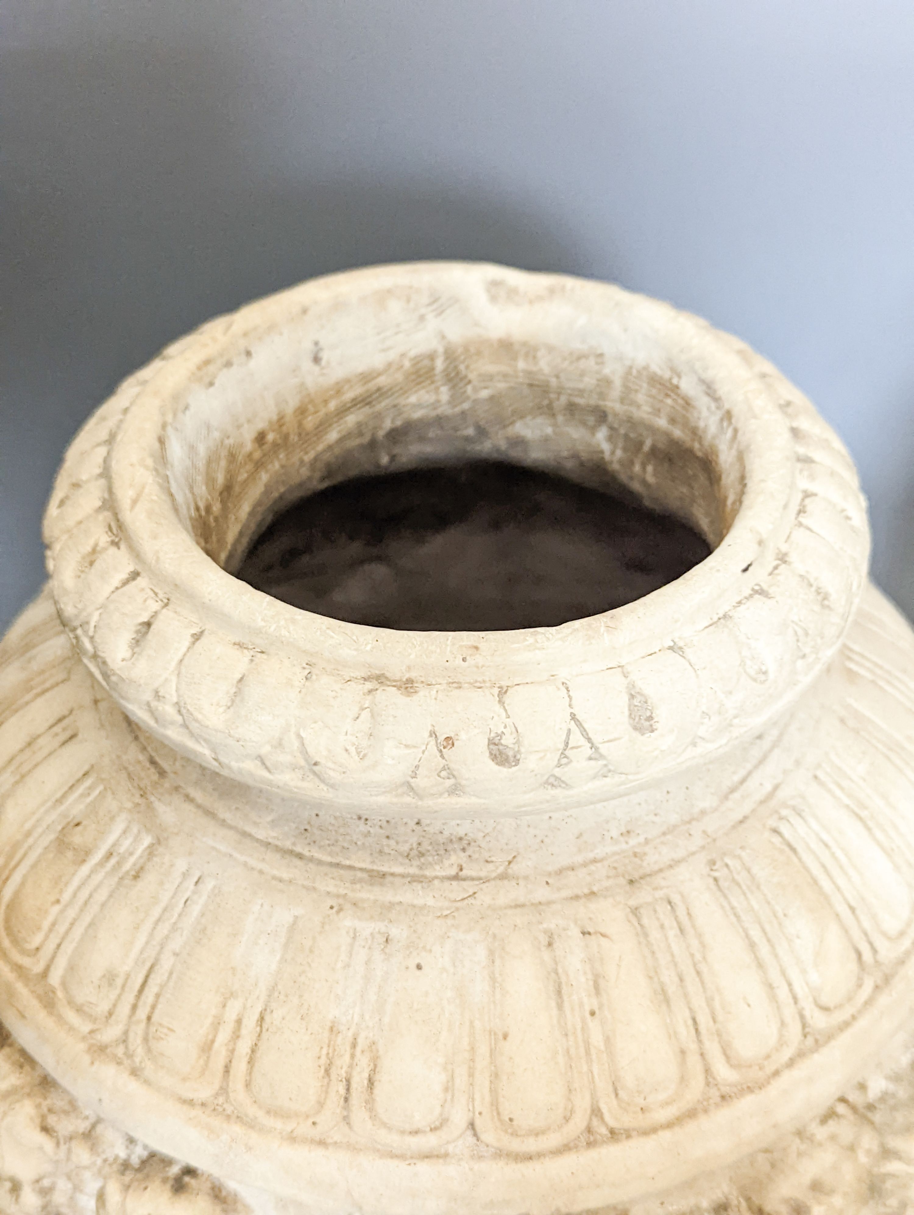 A pair of 19th century earthenware vases moulded in Italian renaissance style 30cm
